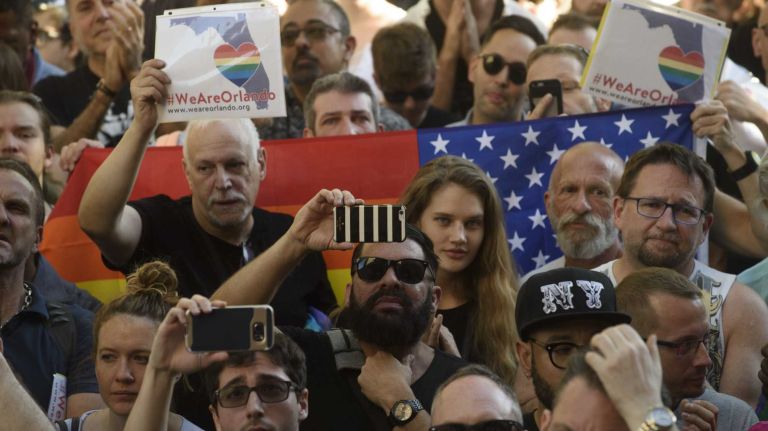 People gather at The Stonewall Inn in Manhattan on Sunday, June 12, 2016, at a vigil for Orlando, Fla., shooting victims. A gunman armed with an assault rifle and handgun killed 49 people and wounded 53 at Pulse, a gay nightclub in Orlando, in what officials termed the worst mass shooting in U.S. history.