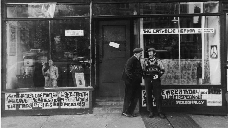 Two men stand outside the offices of the Catholic Worker Movement organization at 175 Chrystie St. in Manhattan on Nov. 9, 1965. That day, a member of the group, Roger LaPorte, set himself on fire in front of the United Nations building in protest over the Vietnam war. LaPorte died a day later.