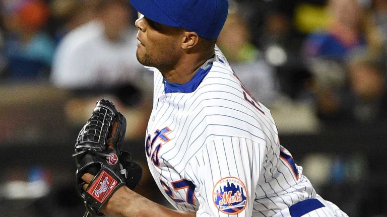 Mets relief pitcher Jeurys Familia delivers a pitch against the Miami Marlins during the ninth inning of a baseball game at Citi Field on Monday, Sept. 14, 2015.