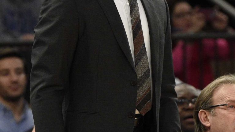 New York Knicks head coach Derek Fisher looks on against the New Orleans Pelicans in the first half of an NBA game at Madison Square Garden on Monday, Jan. 19, 2015.