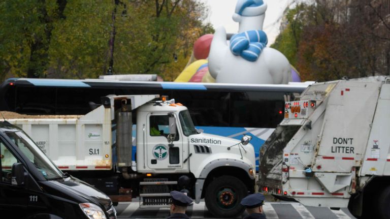 Sand trucks are placed along the route of the 90th Macy's Thanksgiving Day Parade in Manhattan on Nov. 24, 2016.