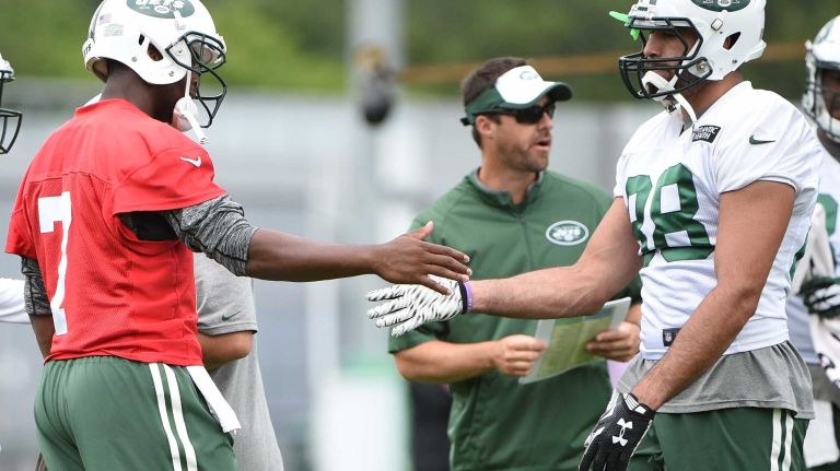 New York Jets quarterback Geno Smith (7) and tight end Jace Amaro (88) slap five during practice at the Jets' Atlantic Health Training Center on Monday, August 10, 2015 in Florham Park, N.J.