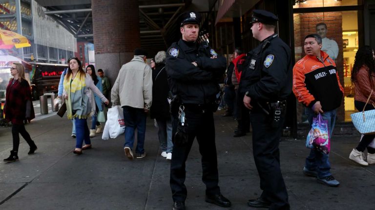 Port Authority plans to hire 250 new police officers to protect airports, tunnels 1 Port Authority police officers patrol the area around the bus terminal on Thursday, Nov. 26, 2015.