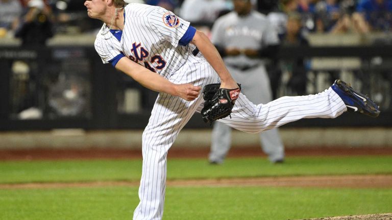 Mets relief pitcher Addison Reed follows through on his pitch against the Miami Marlins during a baseball game at Citi Field on Monday, Sept. 14, 2015.