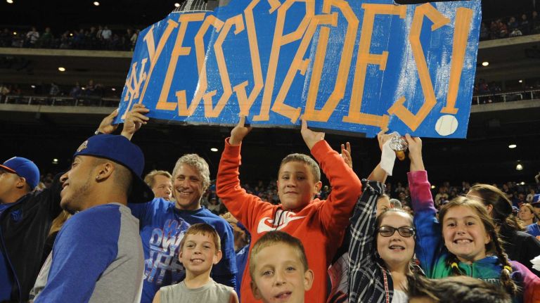 Mets fans hold a sign for Mets left fielder Yoenis Céspedes during a baseball game against the Miami Marlins at Citi Field on Monday, Sept. 14, 2015.