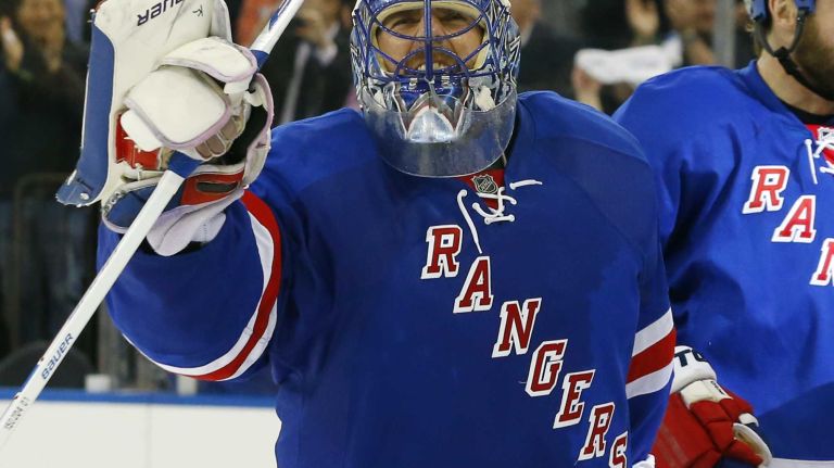 Henrik Lundqvist of the New York Rangers celebrates after defeating the Pittsburgh Penguins in overtime during Game 5 of the Eastern Conference Quarterfinals at Madison Square Garden on Friday, April 24, 2015.