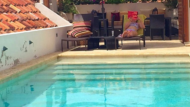Escape the cold in Cartagena, Colombia 2 Relax by the rooftop pool at the boutique hotel Casa del Coliseo.