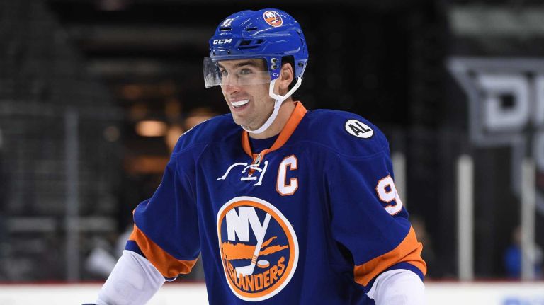 New York Islanders center John Tavares looks on against the New Jersey Devils during the third period of an NHL preseason hockey game at Barclays Center on Wednesday, Sept. 23, 2015.