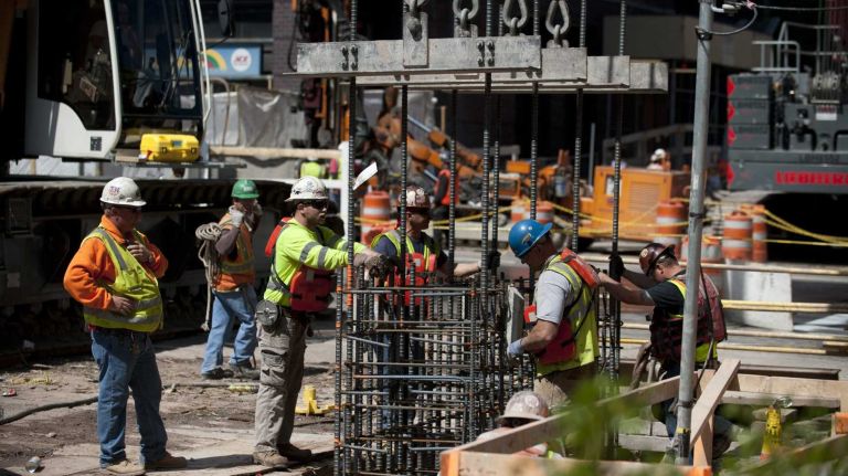 A construction worker places a rebar into the ground on East 94th Street and Second Avenue as they work on phase one of the Second Avenue Subway project in this undated file photo.
