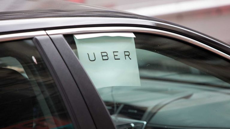 An Uber car waits for a fare in lower Manhattan on Aug. 10, 2015.