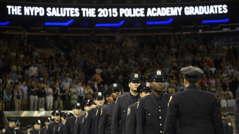 New York City Police cadets march into Madison Square Garden for their graduation ceremony on Thursday, July 02, 2015. The 850-member graduating class is the first to have gone through the department's new Police Academy in College Point, Queens.