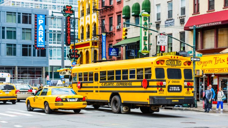 Yellow school bus on 8th Avenue in New York City.