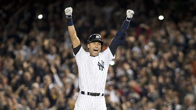 The New York Yankees' Derek Jeter jumps for joy after his game-winning hit against the Baltimore Orioles in the bottom of the ninth inning at Yankee Stadium in the Bronx, Sept. 25, 2014.  It was the Yankees captain's last homestand at Yankee Stadium.