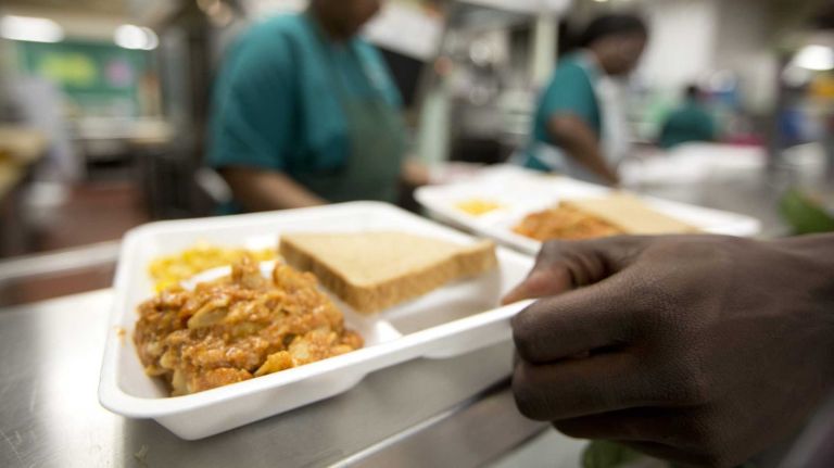 Bakst: Who should decide what your kids eat? 1 Martha Marshall, left, assistant cook at Wyandanch Memorial High School, serves Meatless Monday's lunch on May 12, 2014.