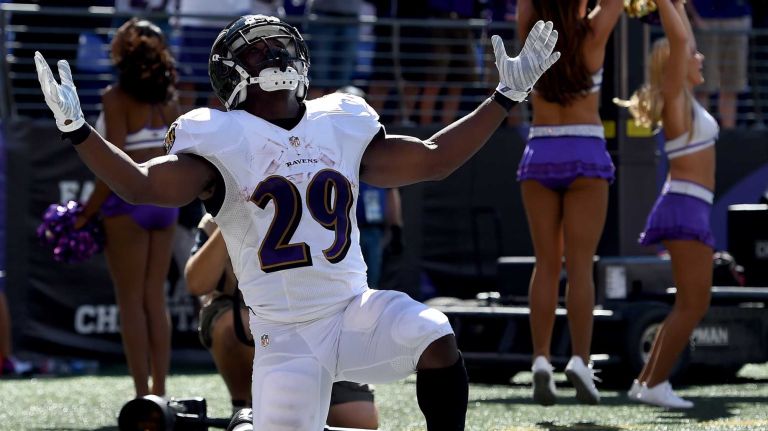 Running back Justin Forsett #29 of the Baltimore Ravens celebrates after scoring a touchdown against the Cincinnati Bengals on September 7, 2014 in Baltimore, Maryland. 