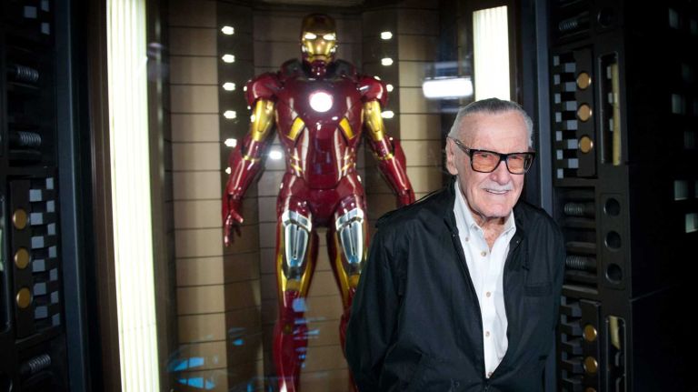 Comic book writer Stan Lee stands before a model of his creation Iron Man at the exhibit of
