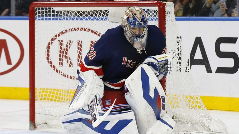 Henrik Lundqvist #30 of the New York Rangers makes a second period save against the Ottawa Senators at Madison Square Garden on Saturday, Apr. 5, 2014 in New York City.
