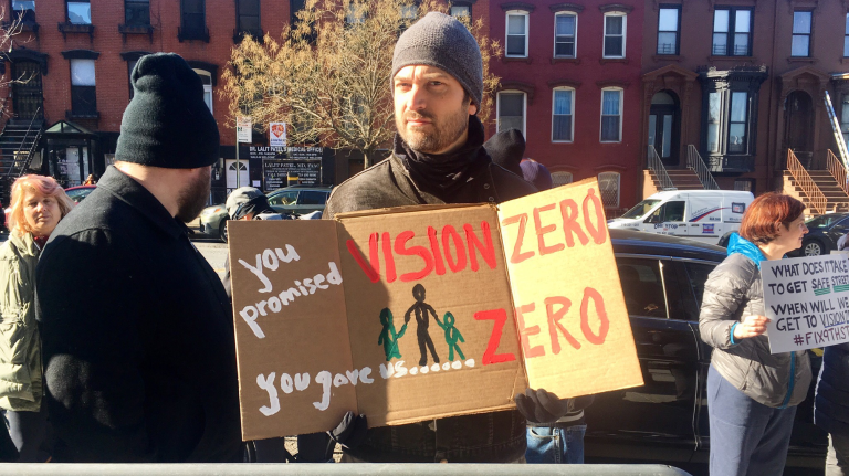 Transit advocates rally outside the Park Slope YMCA, in Brooklyn, on March 6, 2018.