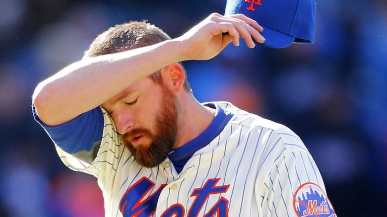 Bobby Parnell walks to the dugout after the ninth inning in which he gave up the lead against the Washington Nationals at Citi Field on Monday, March 31, 2014.