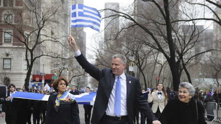 New York City Mayor Bill de Blasio marches in the Greek Independence Day Parade on 5th Avenue in Manhattan, Sunday, March 30, 2014.  