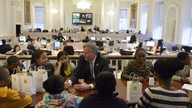 New York City Mayor Bill de Blasio and his wife, Chirlane McCray, speak with a group of Brooklyn middle school students from the Good Shepard Services' after-school program at Red Hook Community Center, Beacon at P.S. 15 and the after-school program at M.S.442.