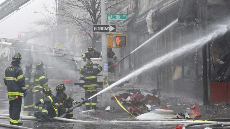 More than 138 firefighters battled a four alarm blaze in the Bronx on March 23, 2014.