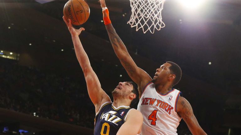Jeremy Tyler of the Knicks defends against Enes Kanter of the Utah Jazz during the first half at Madison Square Garden on Friday, March 7, 2014.
