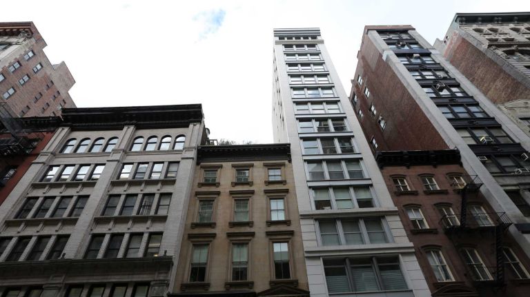 Report: Real estate a boon for New York's tax revenue 2 Buildings along the north side of W 19th St. on Feb. 24, 2014.