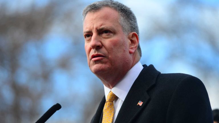Mayor Bill de Blasio is joined by families of traffic fatality victims during a news conference in Woodside, Queens to announce a new plan to reduce the number of people killed during traffic accidents. (Jan. 15, 2014)