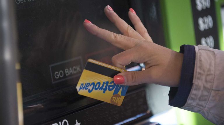 A subway rider re-fills her Metrocard at the Marcy Avenue station in Brooklyn.