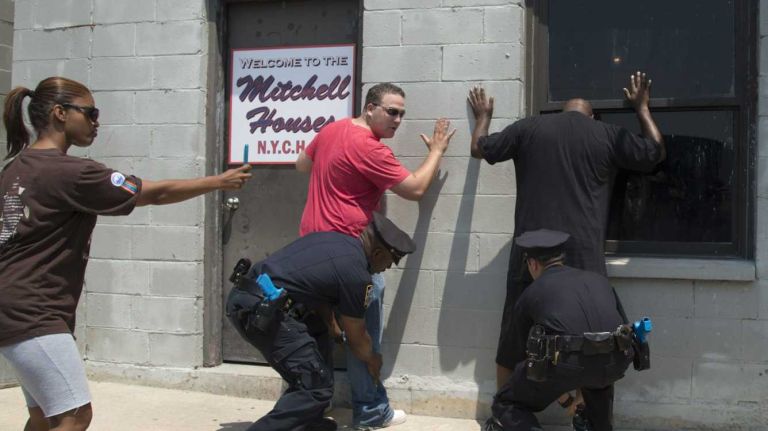 New York City police officers demonstrate the stop-and-frisk tactic at a training facility at Rodman's Neck. (June 12, 2012)