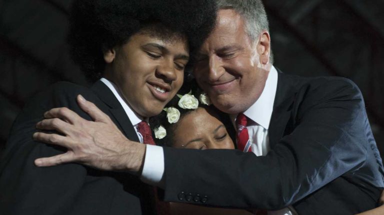 Mayor-elect Bill de Blasio hugs his daughter Chiara and son Dante during a celebration of his victory in the New York City mayoral race on Nov. 5, 2013.