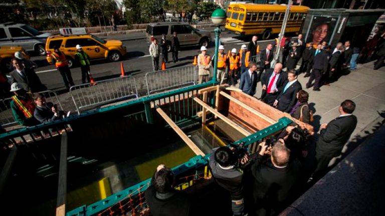 MTA unveils designs to keep the subway dry 1 City brass check out a a test subway entrance cover at South Ferry.