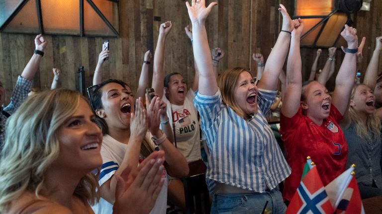 From left to right: Meredith Minsky, Reema Amin, Brittany Haga and Kelly Gonsalves celebrate at Mustang Harry's after Megan Rapinoe's goal on Sunday.&nbsp;
