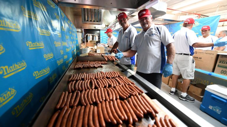 Joey Chestnut devours 12th title at Nathan's Hot Dog Eating Contest in Coney Island 4 Many, many hot dogs were cooked for the annual eating competition.
