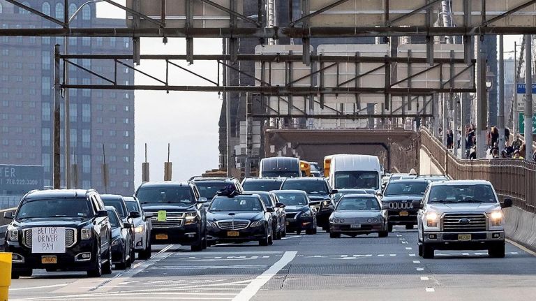 Independent Drivers Guild members take their protest across&nbsp;the Brooklyn Bridge on Wednesday.