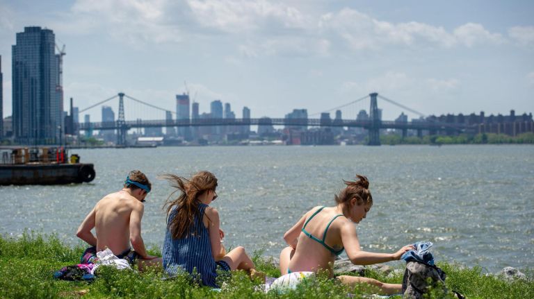 People enjoy the weather in Transmitter Park in Greenpoint.