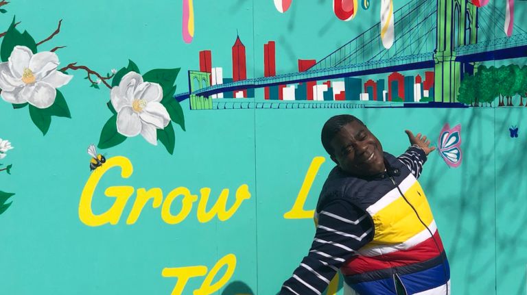 Tracy Morgan poses in front of a new mural by Tiffany B. Chanel in the&nbsp;Hattie Carthan Community Garden in Bed-Stuy.&nbsp;