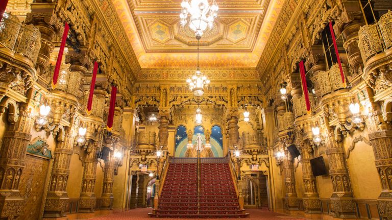 The United Palace in Washington Heights opened in 1930, featuring neoclassical architecture. It is currently owned by the United Palace of Spiritual Arts (formerly the United Christian Evangelistic Association).