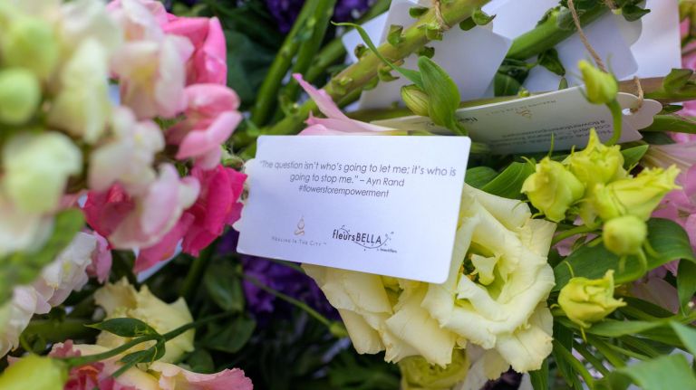 Inspirational quotes from women throughout history were attached to the flowers.