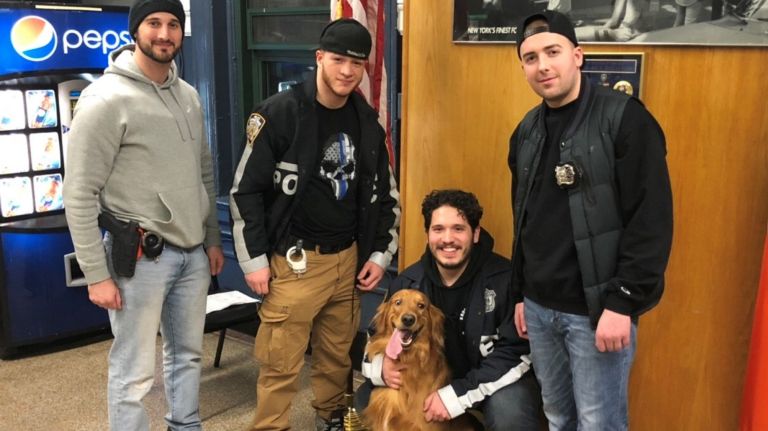 Scooby was&nbsp;returned to his&nbsp;owner on Thursday, police said. Pictured, police officers&nbsp;James Mauro, Christopher Matthews, Nicholas Occhipinti and Anthony Brucato with Scooby.