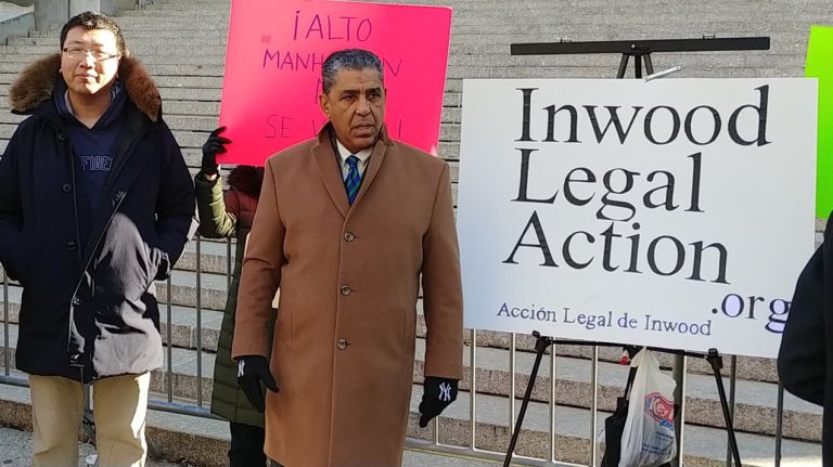 Rep. Adriano Espaillat, center, announces his support for a lawsuit filed Monday to stop the rezoning of Inwood.