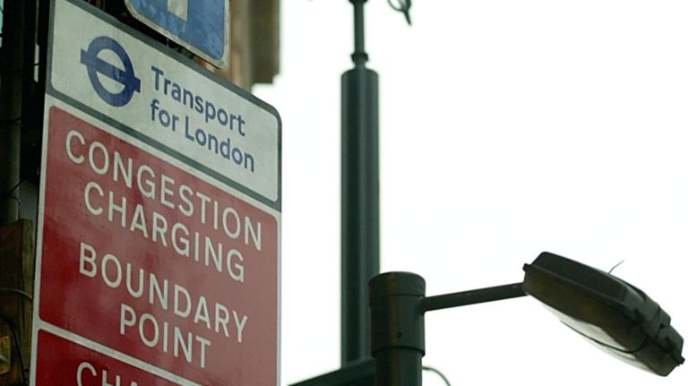 A sign informs motorists that they are entering a congestion charge zone, next to cameras that will photograph license plates to enforce the&nbsp;charge on January 3, 2003 in London, United Kingdom.&nbsp;