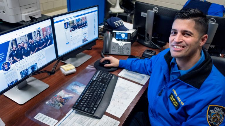 NYPD Officer Anthony Nuccio, a crime prevention and digital communications officer for 19th Precinct, works at his East Side post.