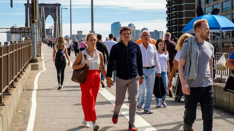 Pedestrians pack the Brooklyn Bridge walkway on Sep. 27, 2018.