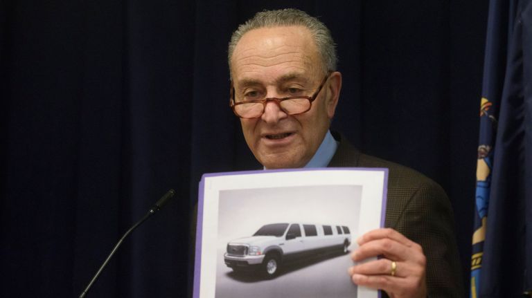 Sen. Chuck Schumer holds a picture of a stretch limousine like the one that crashed upstate, killing 20.