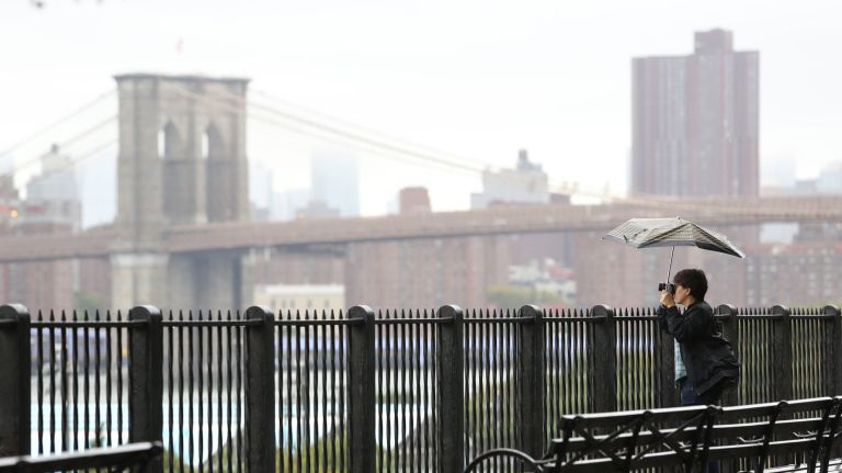 Visitors to the Brooklyn Promenade&nbsp;take in the view on Thursday.