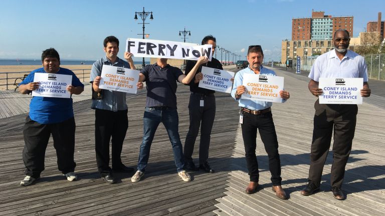 NYC Ferry expansion sought by Coney Island Alliance 2 Protesters hold signs reading "Coney Island demands ferry service" and "Ferry now."