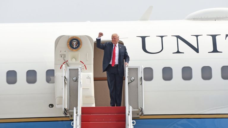 President Donald Trump,  pumping his fist as arrives at Gabreski Airport in Westhampton on Friday, has called the news media the 