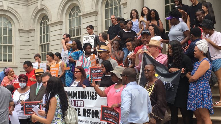 Eric Garner’s mom calls for officers involved in son’s death to be fired 2 Activists gather on the steps of City Hall in Manhattan on Tuesday for a news conference calling for the firing of the officers involved in the death of Eric Garner.